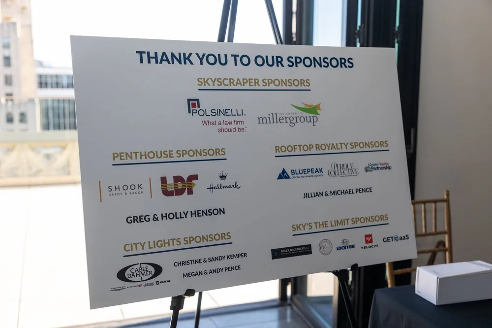 Sponsor board for Elevate: A Night Above the City, listing BluePeak Digital Insurance Agency among the Rooftop Royalty sponsors.